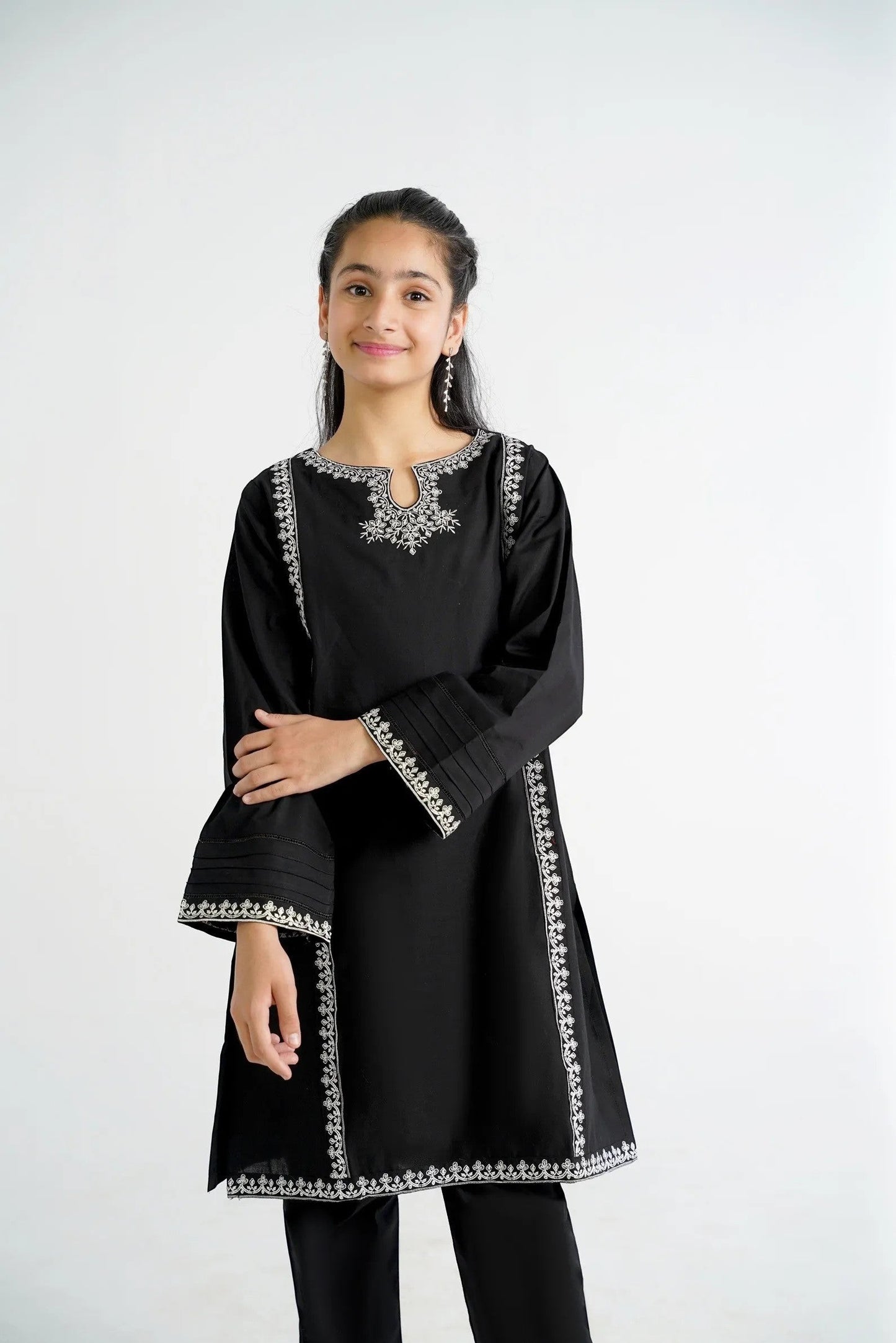 Lily black cotton kurta with white embroidery on neckline and sleeves, paired with black pants.