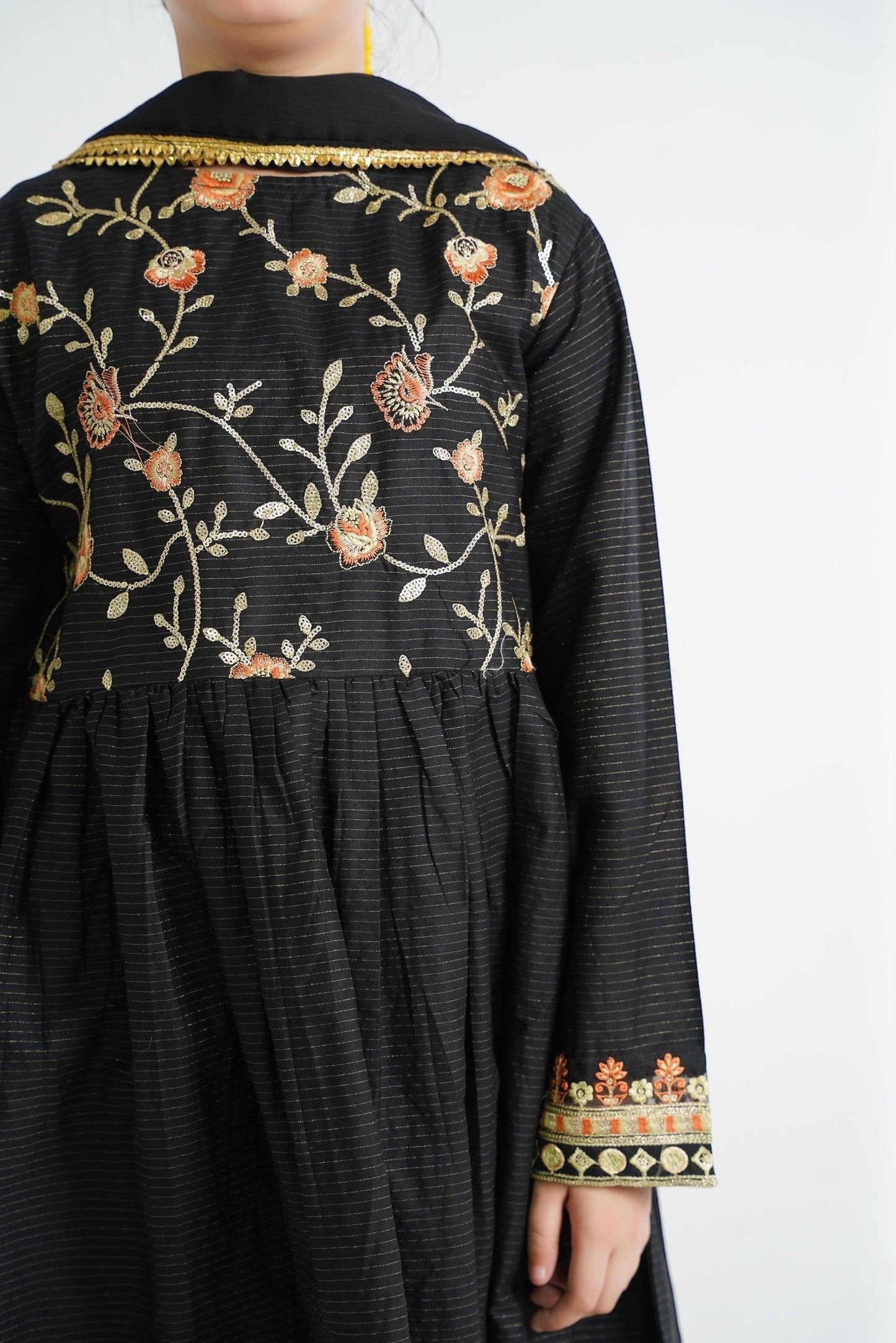 Lily black embroidered kurta set with paisley and floral motifs, gold trim collar, and embellished cuffs. Suitable for festive occasions.