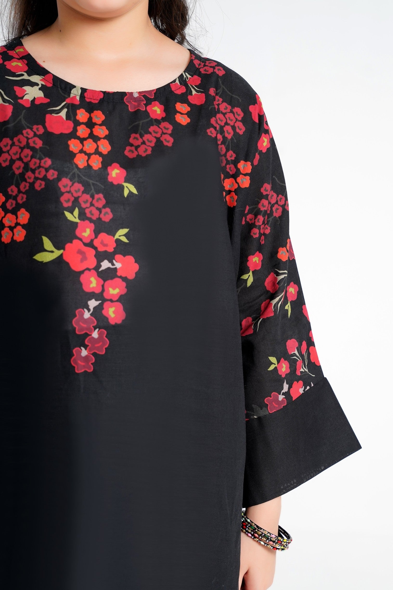 Lily black kurti with red and orange floral print, flared sleeves, and round neckline. Girls' festive wear.
