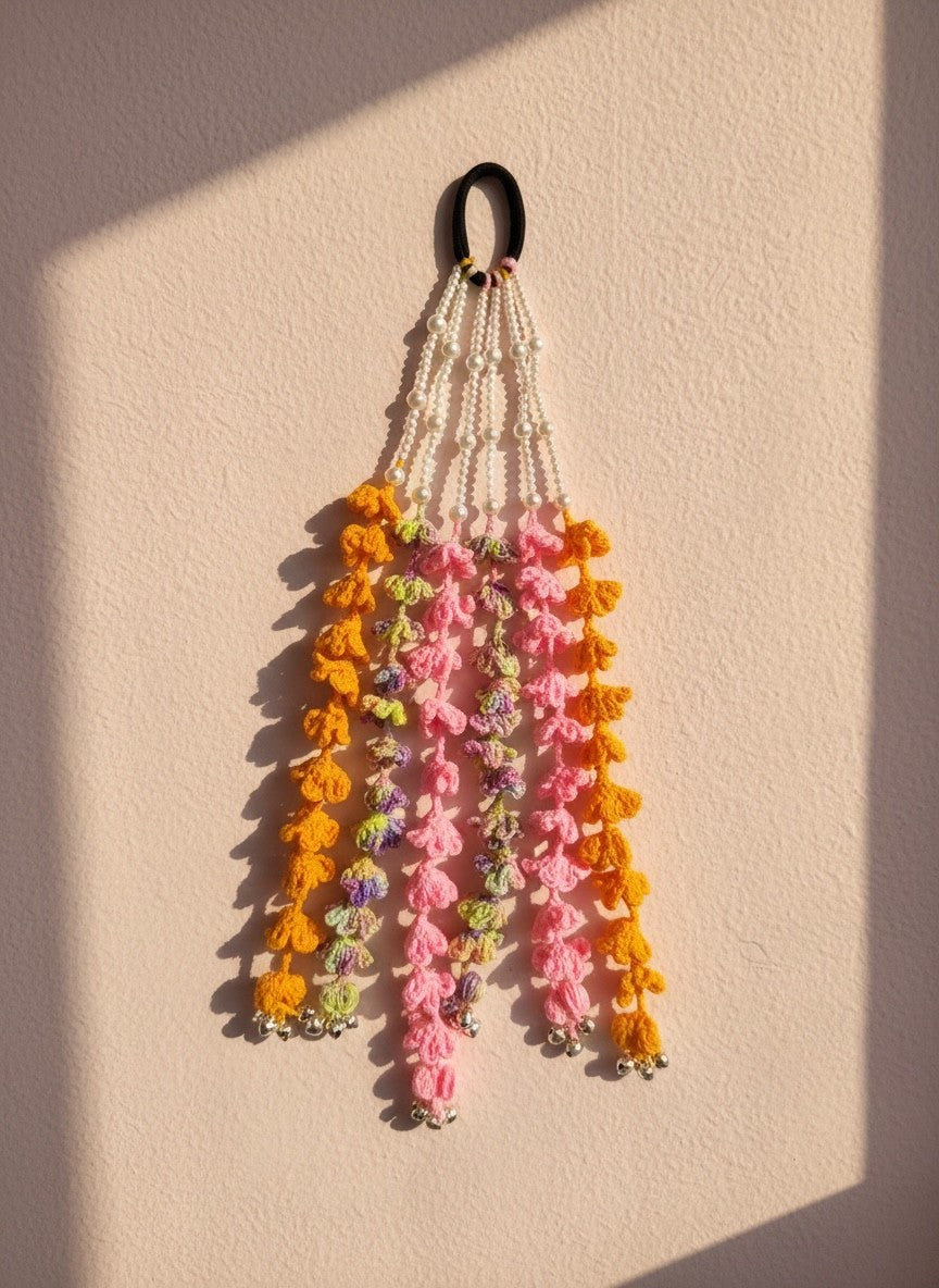 Lily bohemian hair accessory with crochet tassels in orange, pink, purple, white beads, and silver bells.