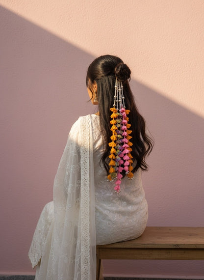 Lily bohemian hair accessory with colorful crochet tassels in orange, pink, purple, white beads, and silver bells.
