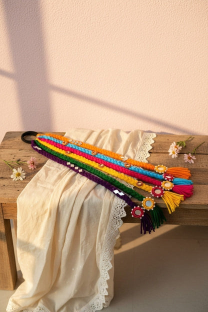 Lily braided hair accessory with colorful threads, mirrors, and tassels. Bohemian style.