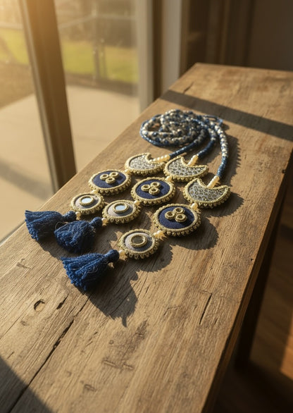 Lily Chaand Rani Paranda hair accessory in navy blue and cream with mirror work, embroidery, and tassel details.