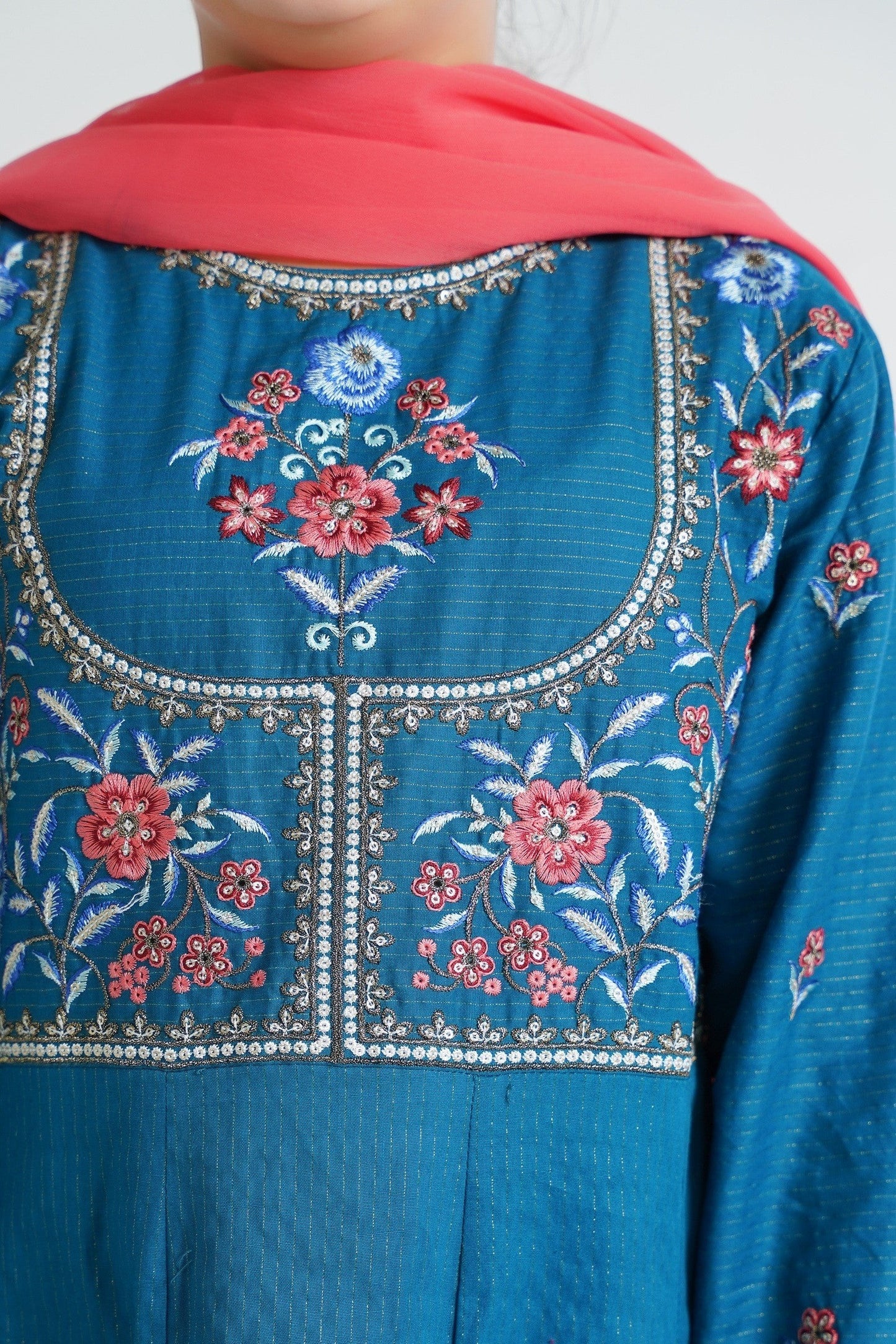 Lily embroidered teal Anarkali suit set for girls with floral embroidery and coral dupatta. Flared kurta with textured fabric.