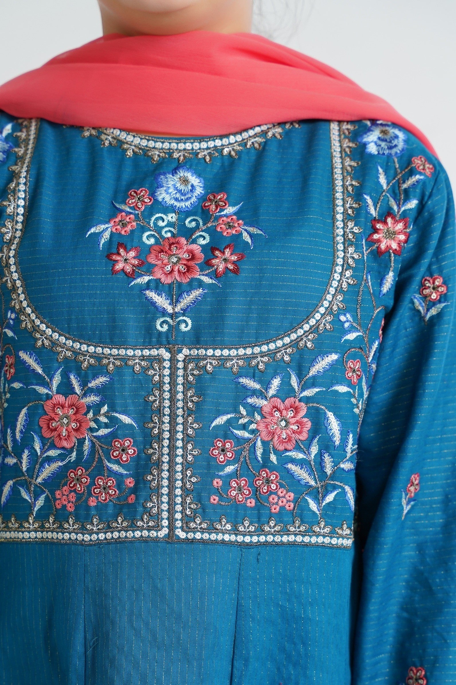 Lily embroidered teal Anarkali suit set for girls with floral embroidery and coral dupatta. Flared kurta with textured fabric.