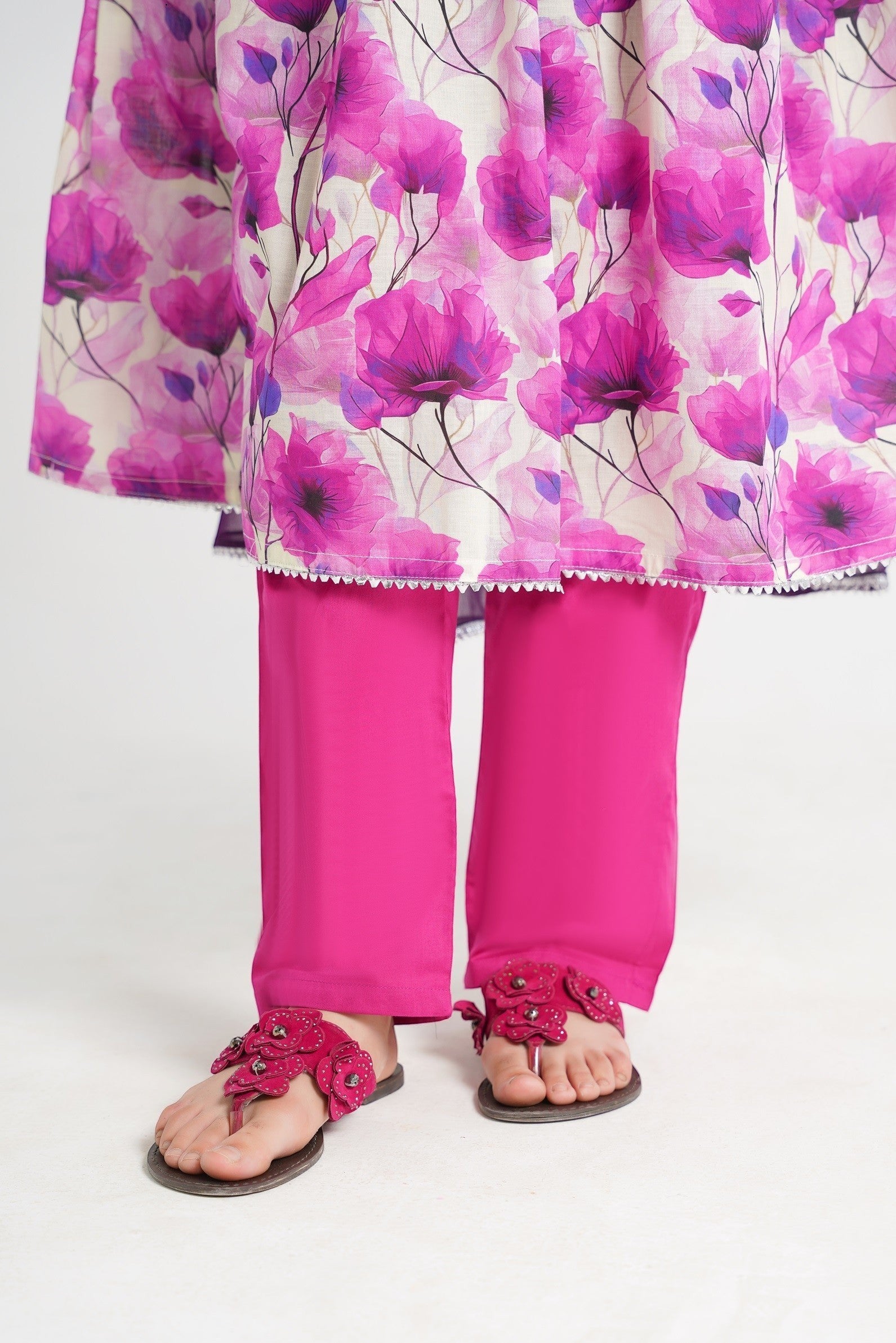 Lily cream Anarkali suit with pink floral print, pink trousers, and embroidered yoke. Girls' festive wear.