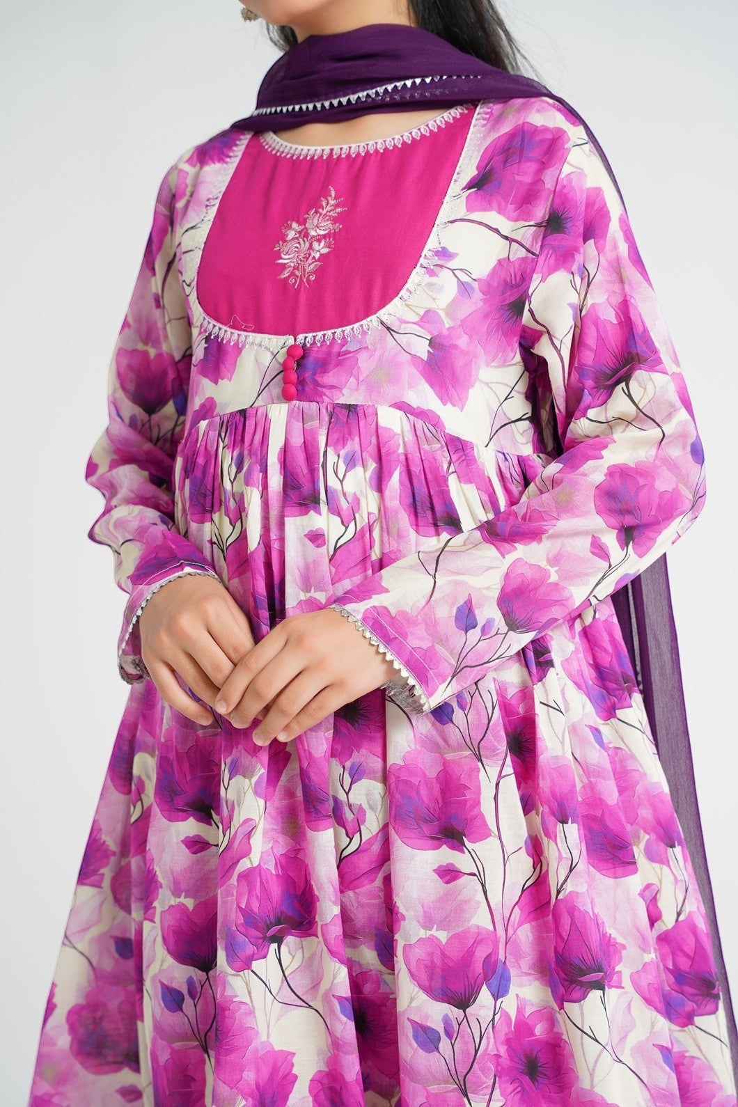 Lily cream Anarkali suit with pink & purple floral print, embroidered yoke, and dupatta.