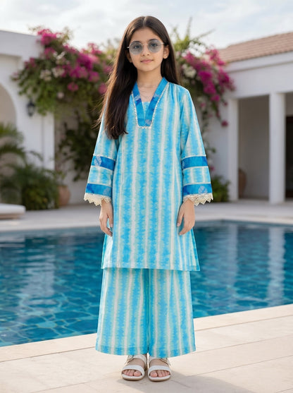 Lily girls blue and white tie-dye kurta set with V-neck, lace trim, and wide-leg trousers worn by a young girl outdoors.