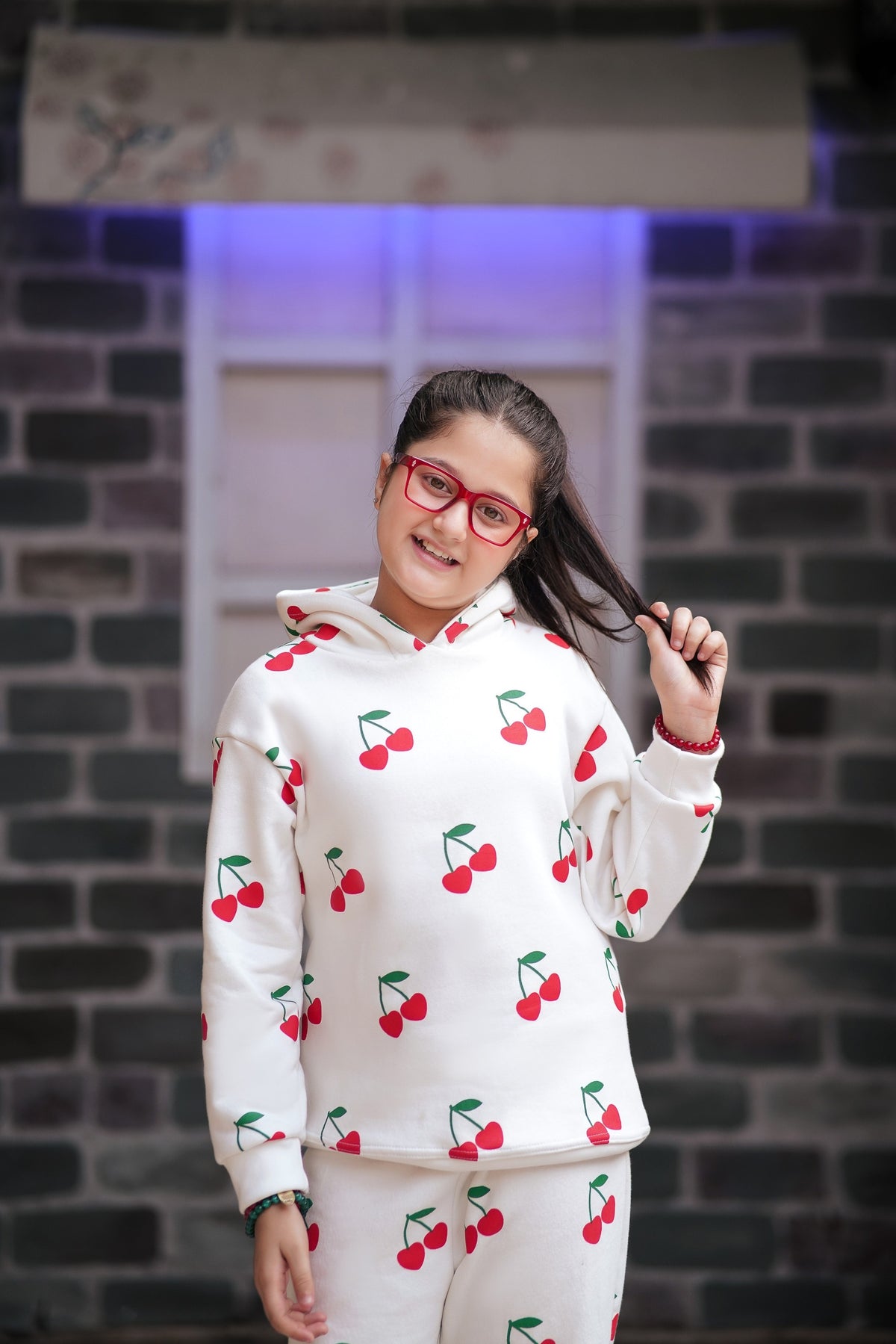 Lily girls white loungewear set with red cherry print, featuring a hooded sweatshirt and matching pants.