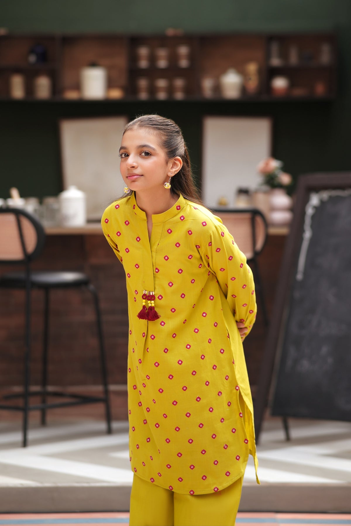 Lily girls yellow kurta with pink geometric embroidery, mandarin collar, and tassel detail paired with matching pants