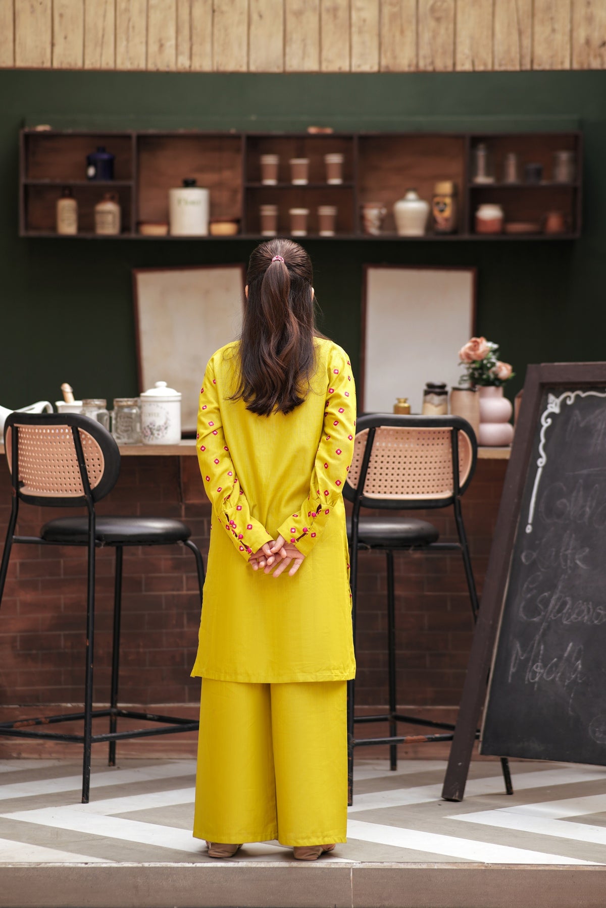 Lily girls yellow kurta and wide-leg trouser set with pink geometric embroidery and tassel detail, back view