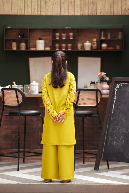 Lily girls yellow kurta and wide-leg trouser set with pink geometric embroidery and tassel detail, back view