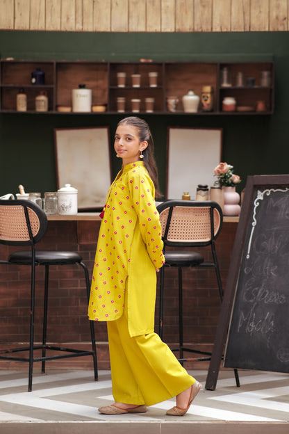 Lily girls yellow kurta and trouser set with pink geometric embroidery, mandarin collar, and tassel detail.