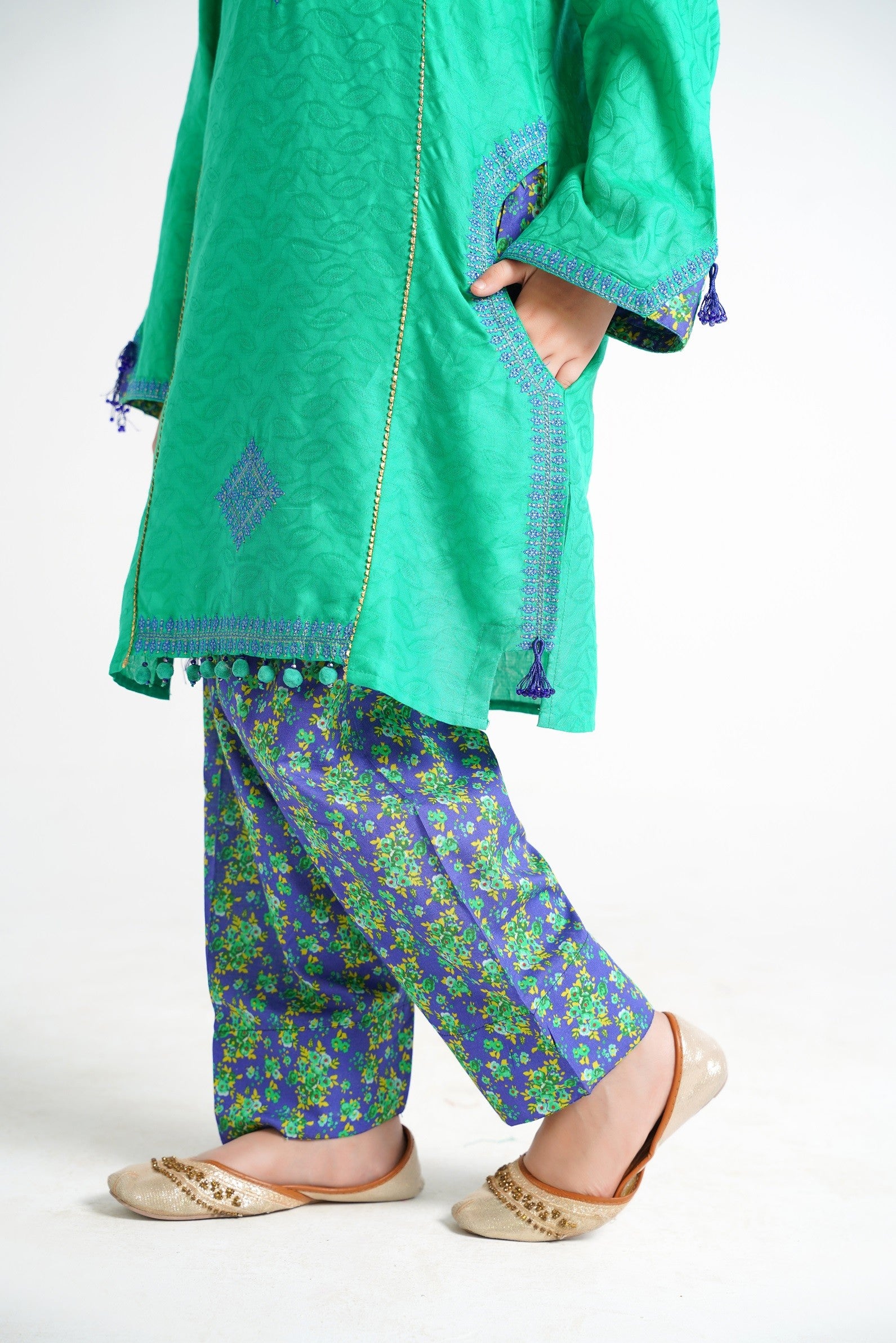 Lily green embroidered kurta with blue floral print pants and dupatta for girls. Features tassels and intricate embroidery.