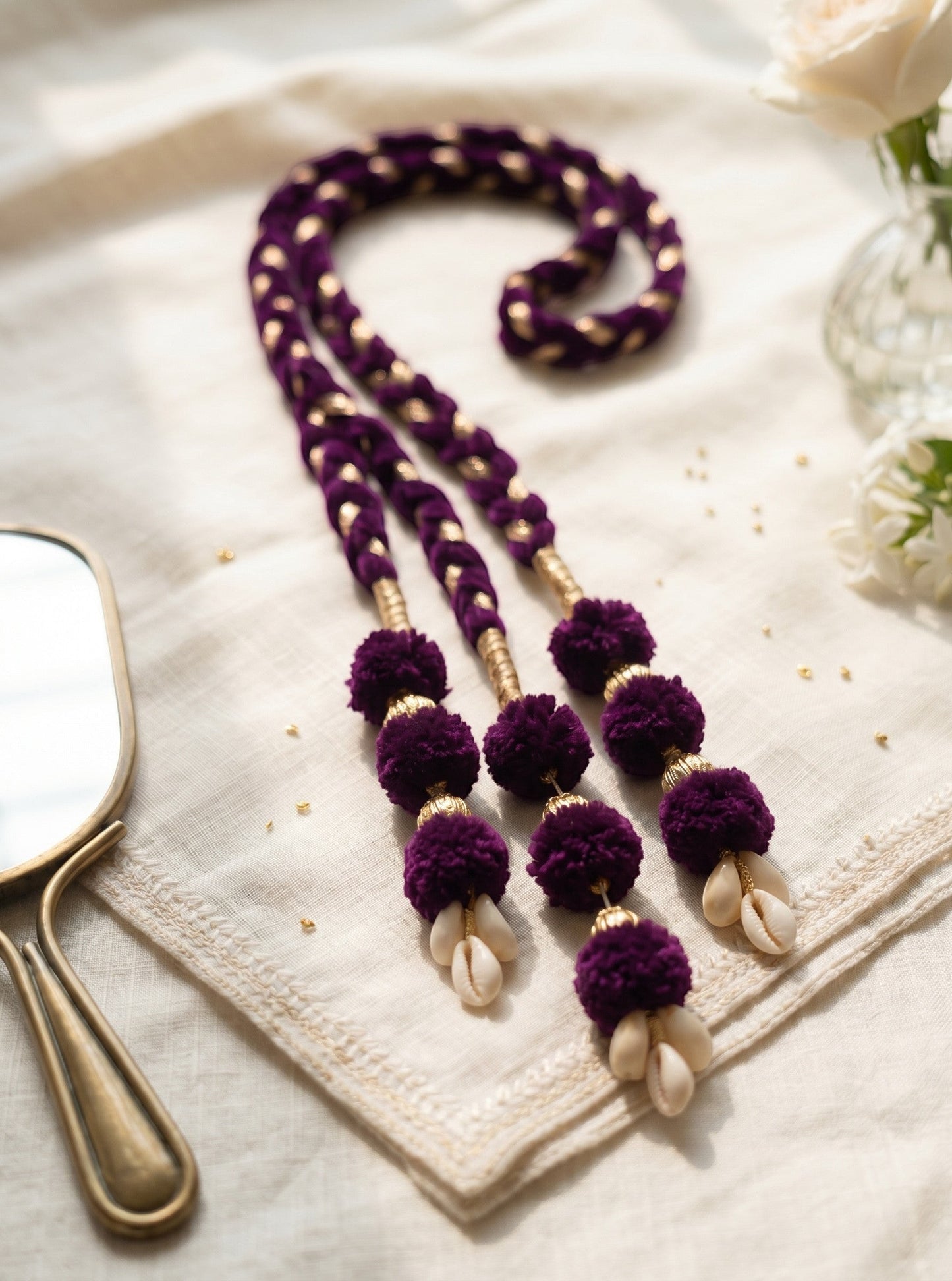 Lily Lavender Noor Paranda hair accessory with velvet braiding, gold accents, pom-poms, and cowrie shell details.