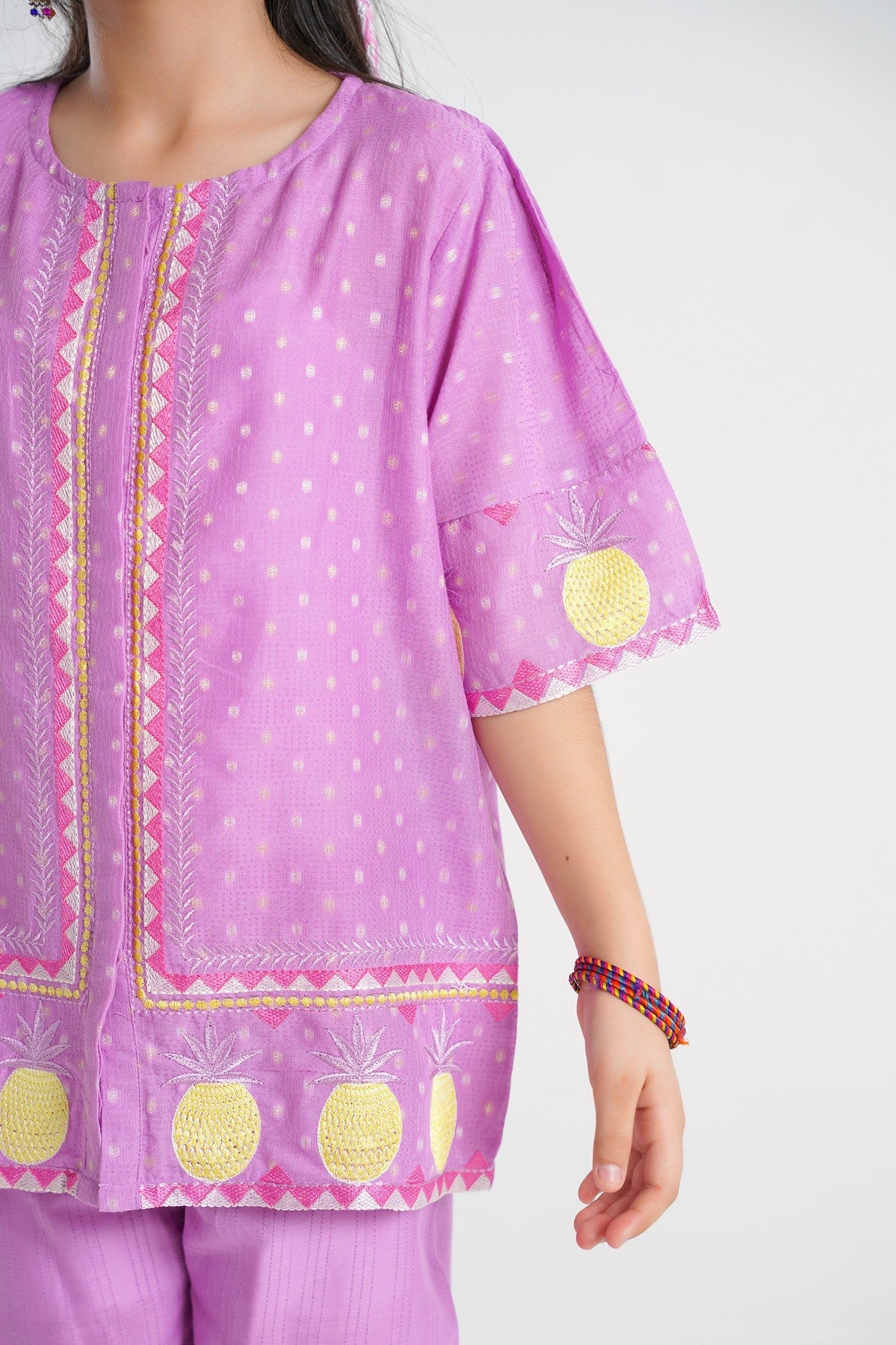 Lily lavender cotton top and pants set with embroidered pineapple motifs and polka dot pattern.