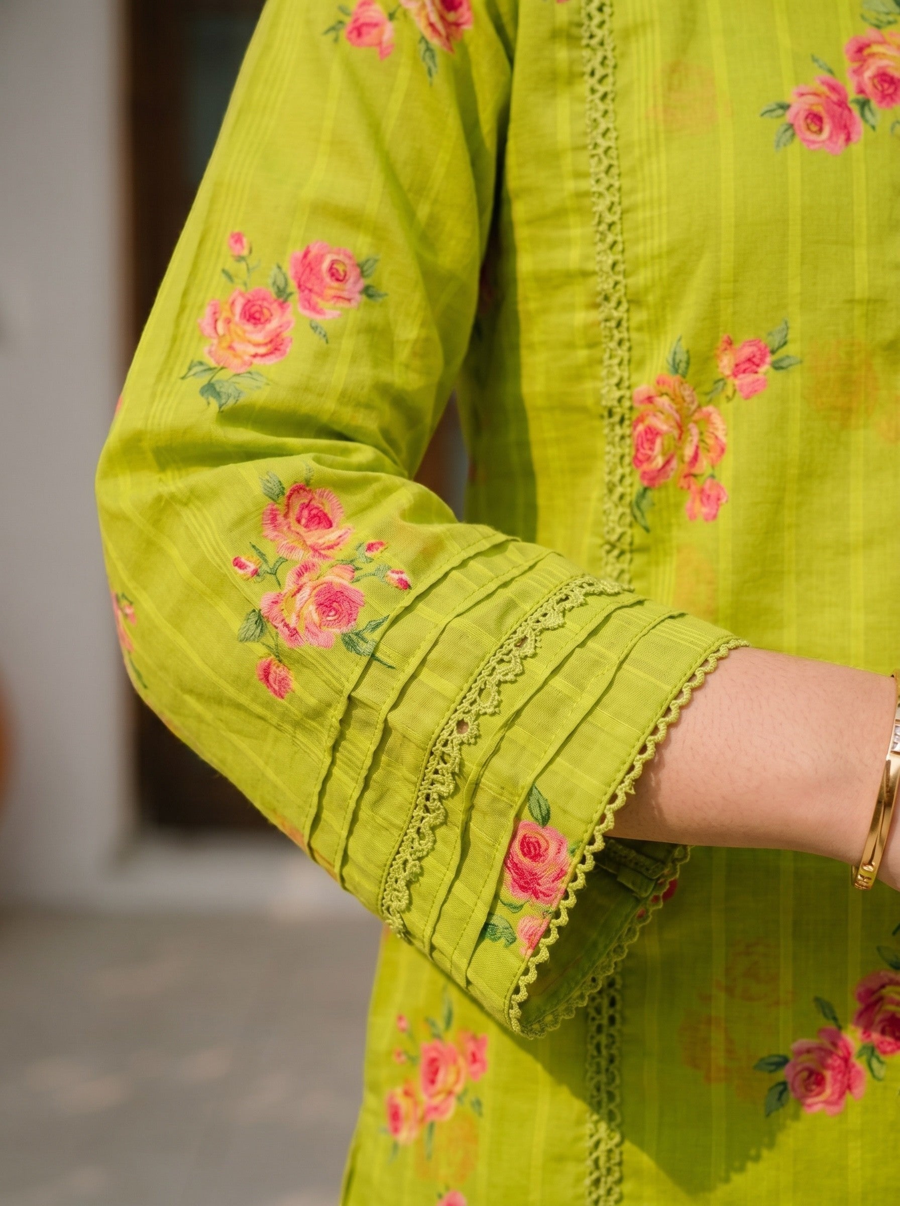 Lily lime green kurta with pink floral print, lace inserts, and pleated cuffs on long sleeves