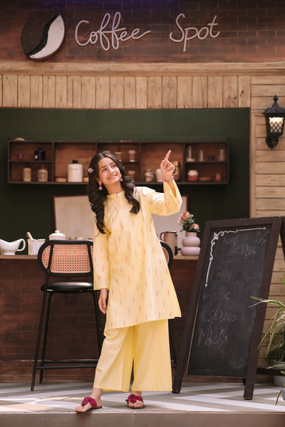 Lily pastel yellow two-piece kurta set with vertical patterns, mandarin collar, and wide-leg trousers on a young girl.