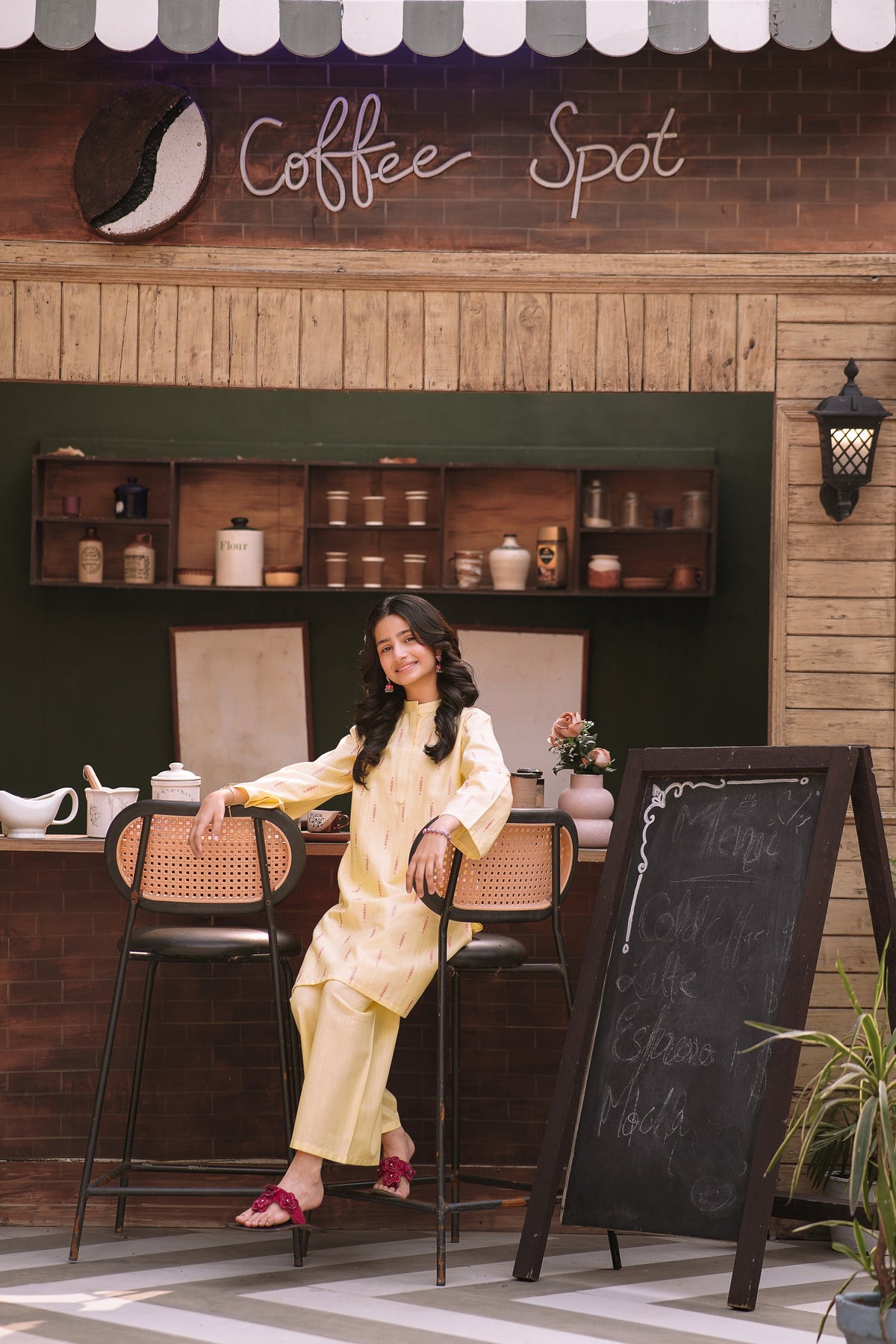 Lily pastel yellow two-piece kurta set with minimalist vertical patterns, mandarin collar, and wide-leg trousers.