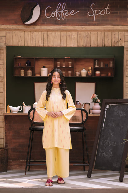 Lily pastel yellow two-piece kurta set with vertical patterns, mandarin collar, and wide-leg trousers on a young woman