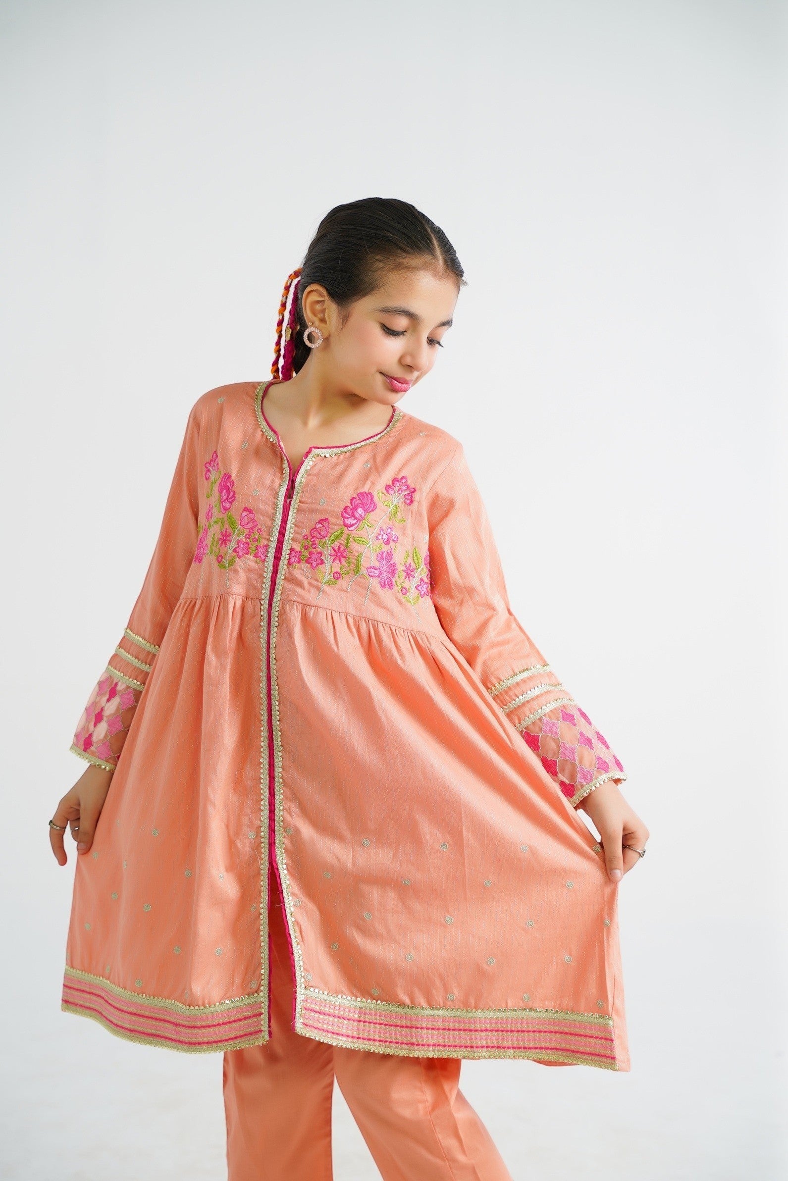 Lily peach embroidered kurta and pants set for girls, featuring floral motifs and border detailing. Lightweight fabric for comfort.