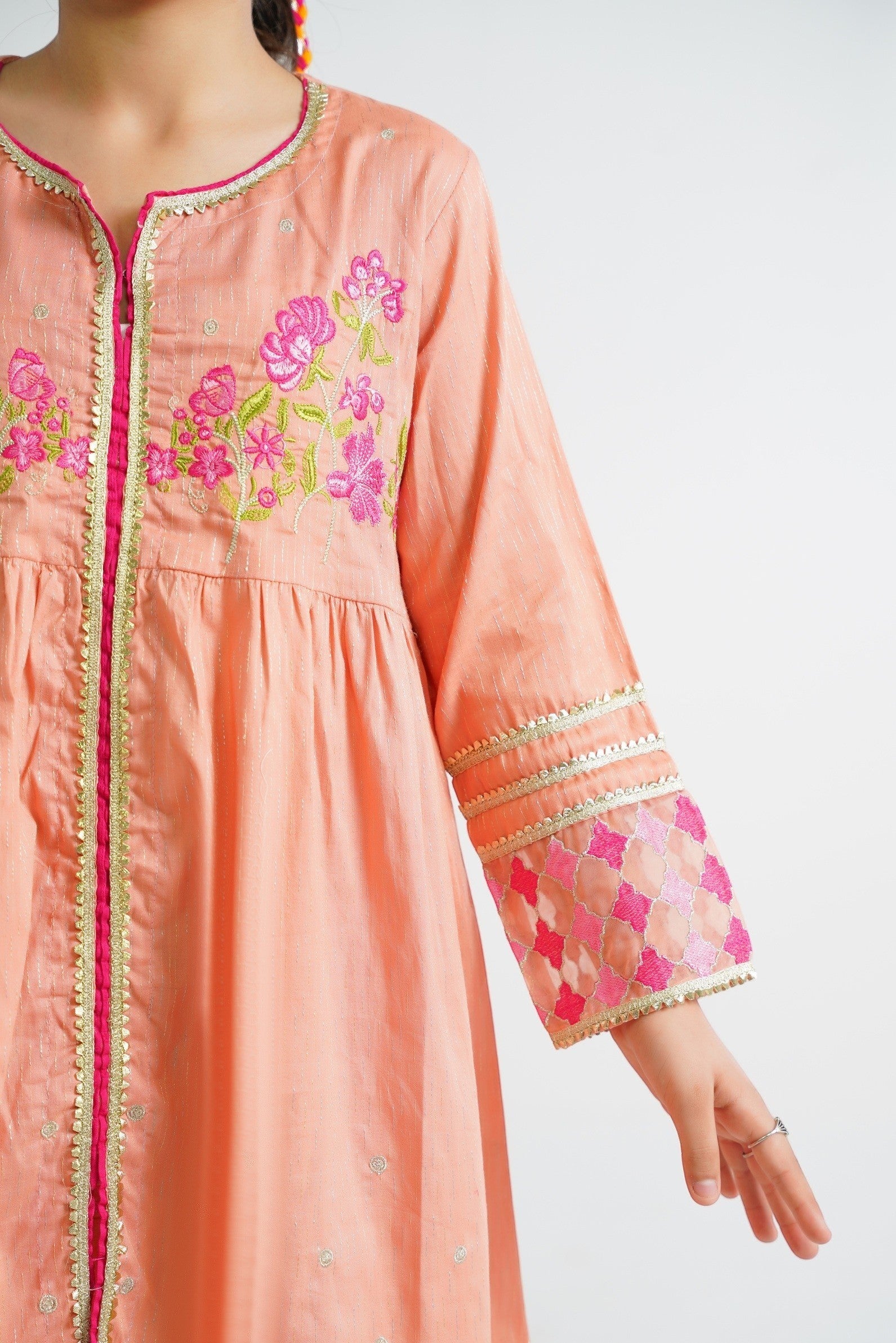 Lily peach embroidered kurta and pants set for girls, featuring floral motifs and border detailing.