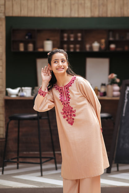 Lily girls peach kurta and trouser set with magenta floral embroidery and mirror work on the neckline and cuffs