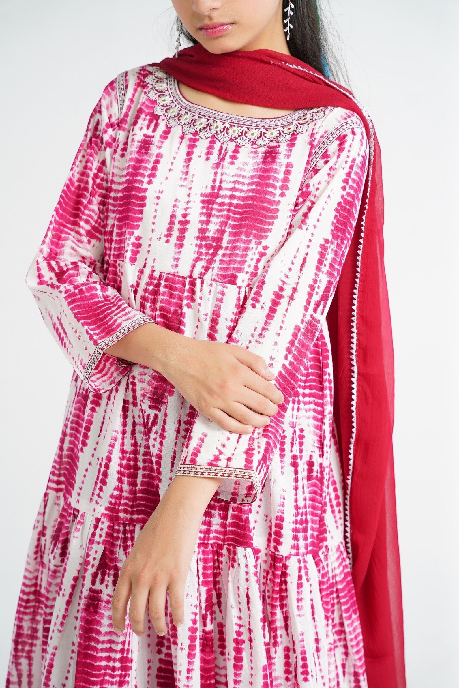 Lily tiered cotton kurta set with pink and white tie-dye print, embroidered neckline, and red dupatta.