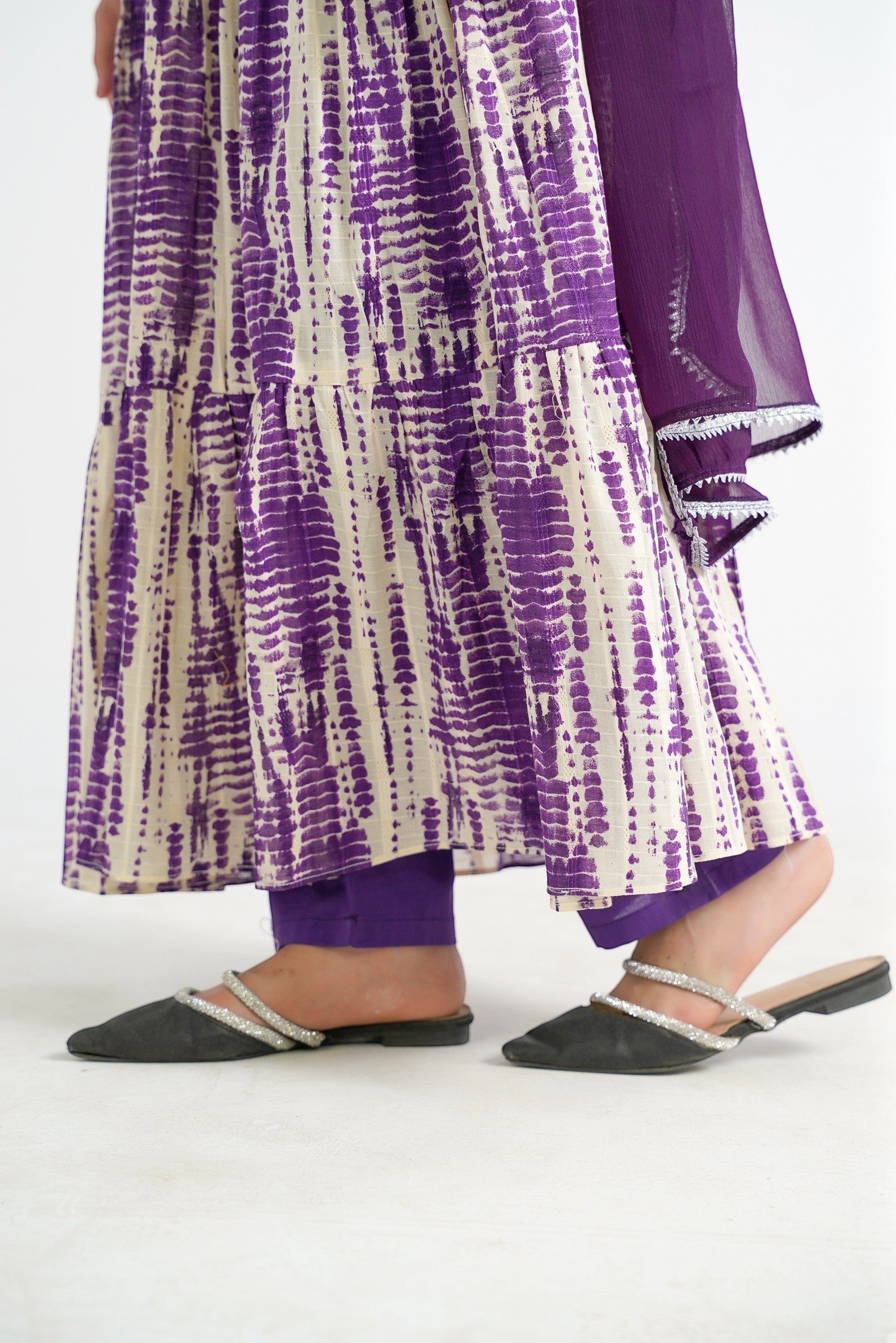 Lily tiered maxi dress in purple and cream tie-dye print, with matching scarf and purple trousers.