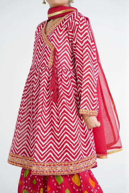 Lily red and white chevron print angrakha kurta with embroidery and tassels, paired with red gharara pants and dupatta.