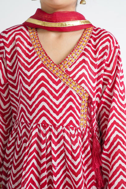 Lily red and white chevron print angrakha style kurta with embroidery and tassels, paired with sharara pants and dupatta.