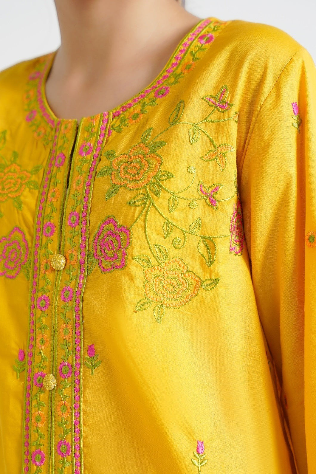 Lily yellow embroidered kurta set for girls with floral motifs in pink and green. Features a round neck and button placket.