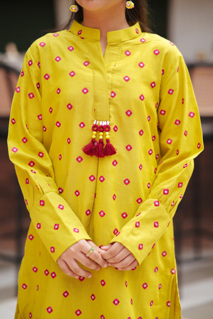 Lily girls yellow kurta with pink geometric embroidery, mandarin collar, and decorative tassel detail.